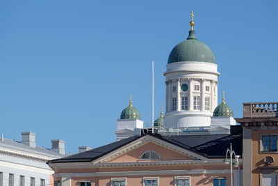 Low angle view of building against clear blue sky