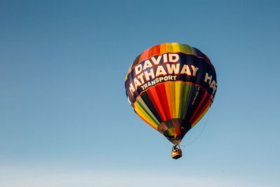 Low angle view of hot air balloon against clear sky