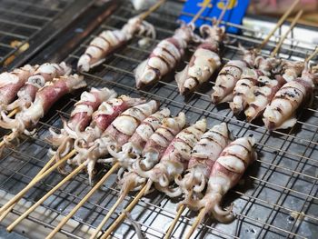 High angle view of meat on barbecue grill