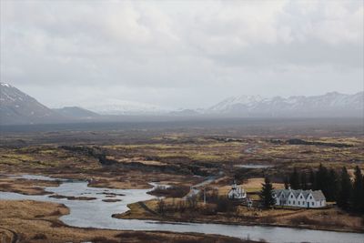 Scenic view of lake and mountains against sky