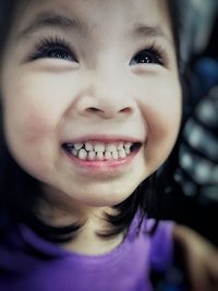 Close-up portrait of smiling girl