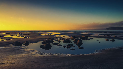 Scenic view of sea at sunset