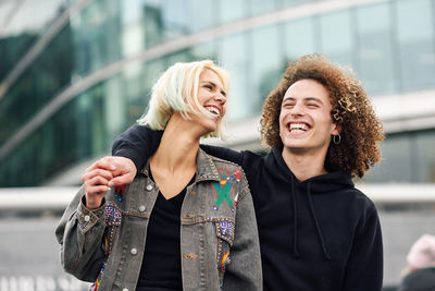 Cheerful young couple in city