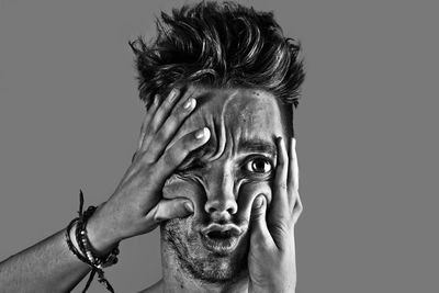 Close-up of human hand against gray background