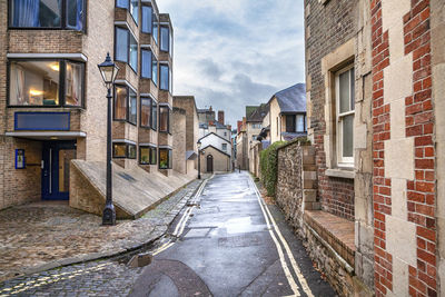 Street amidst buildings against sky