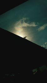 Silhouette mountain against sky at night