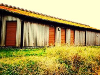 House on grassy field