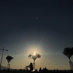 Low angle view of silhouette trees against sky during sunset