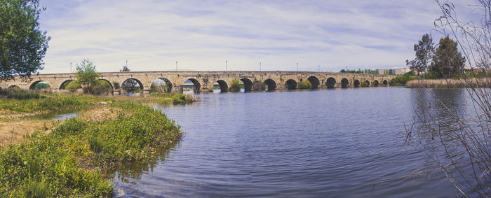 Panoramic view on the historical roman bridge over the guadiana river in merida, spain.