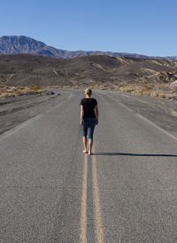 Full length rear view of a woman walking