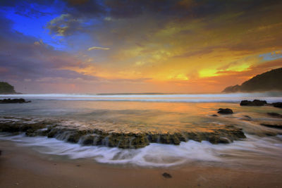 Scenic view of sea against sky during sunset