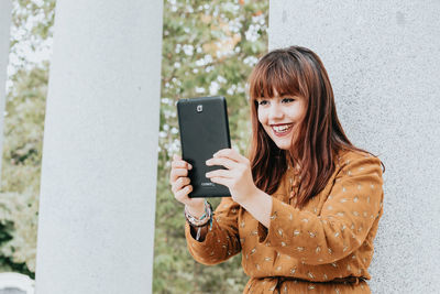 Young woman using mobile phone