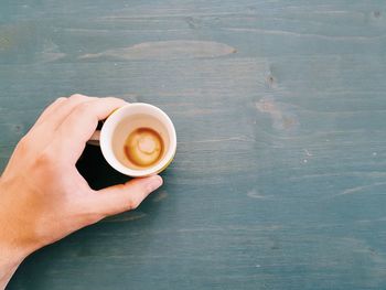 High angle view of coffee cup on table