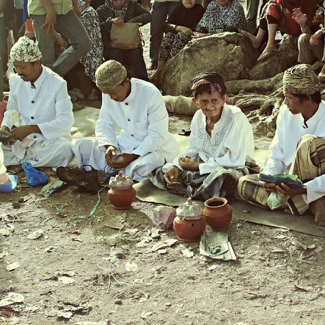 lifestyles, leisure activity, childhood, casual clothing, togetherness, sitting, large group of objects, men, abundance, day, outdoors, art and craft, standing, boys, cultures, full length, high angle view