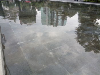 Reflection of building on puddle