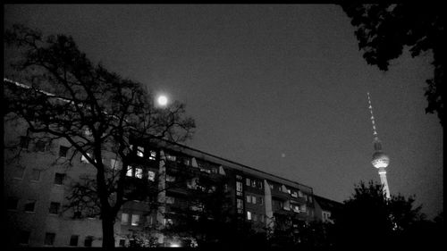 Low angle view of illuminated street light at night