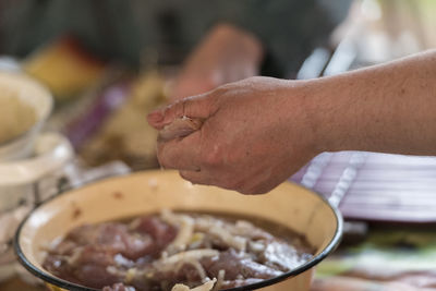 Close-up of man preparing food