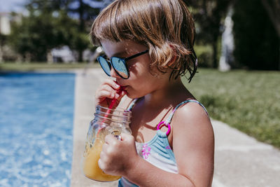 Portrait of girl drinking water