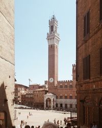 Low angle view of piazza del campo against clear sky during sunny day
