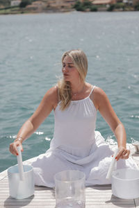 Portrait of young woman in water