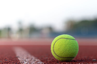 Close-up of tennis ball on court