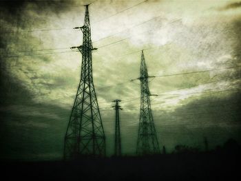 Low angle view of electricity pylon against sky