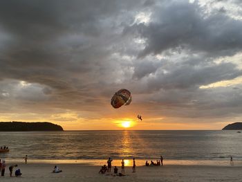 Scenic view of beach against sky during sunset