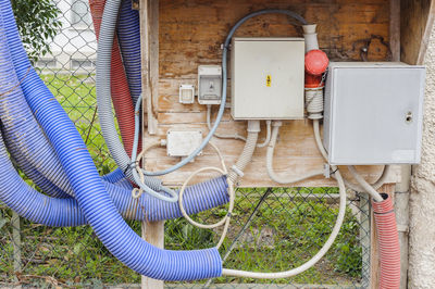 Control panel against fence on field