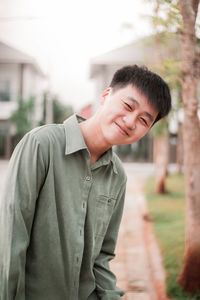 Portrait of smiling boy standing out