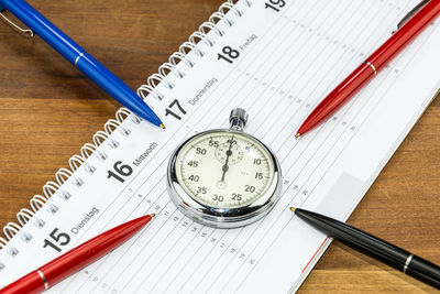 High angle view of clock on table