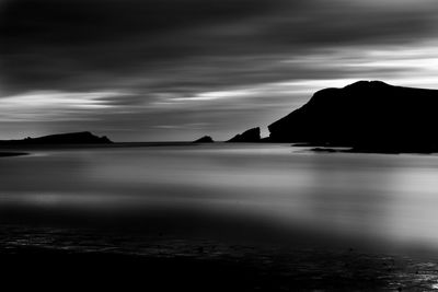 Scenic view of sea against cloudy sky