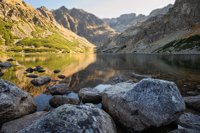 Scenic view of lake and mountains against sky