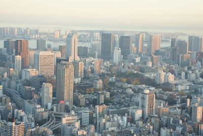 High angle view of modern buildings in city against sky