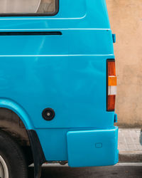 Close-up of car on road