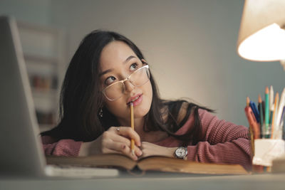 Portrait of a beautiful young thinking woman