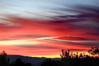 Scenic view of dramatic sky during sunset