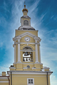 Low angle view of clock tower against sky