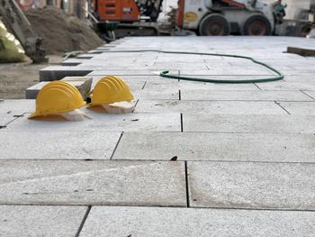 Hardhats, workers protection equipment on sidewalk of a construction site