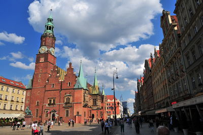 Group of people in front of buildings in city