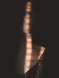 Close-up portrait of woman in sunlight