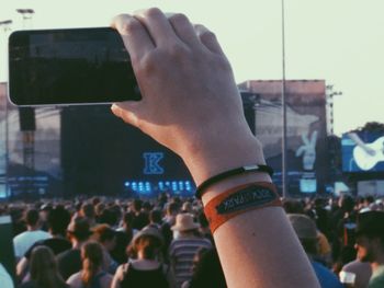 Close-up of hands holding camera