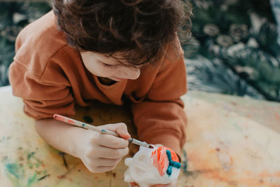 The boy draws with felt-tip pens. high quality photo