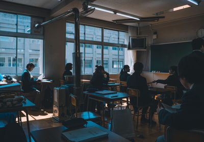 People working in room