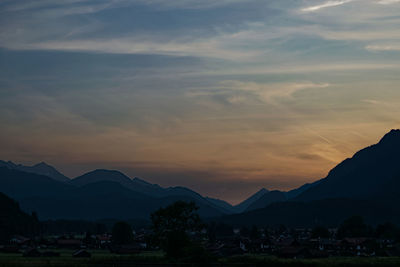 Scenic view of silhouette mountains against sky during sunset