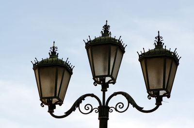 Low angle view of street light against sky