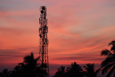 Evening sky, sun set, silhouette electricity pylon against sky during sunset