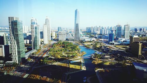 High angle view of buildings in city against sky