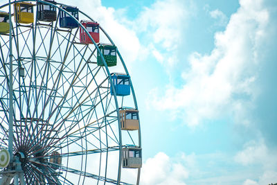 Low angle view of ferris wheel against sky