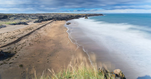 Scenic view of beach against sky