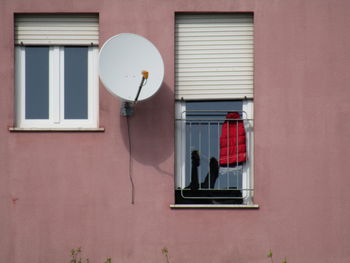 Clothes hanging on wall of building